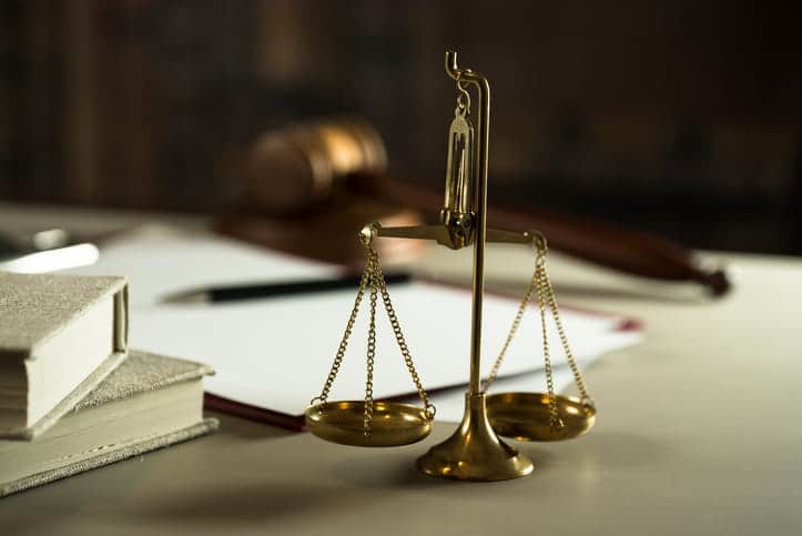 The scales of justice on a car accident injury attorney's desk. 