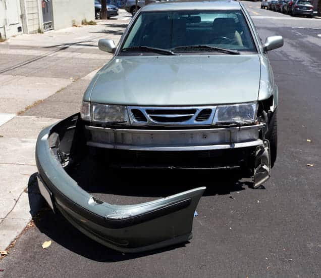 A damaged vehicle with its bumper removed after a car accident.
